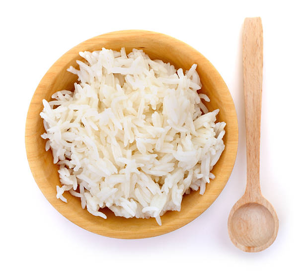 istock Cooked white rice in wooden bowl isolated on white background 2237091846