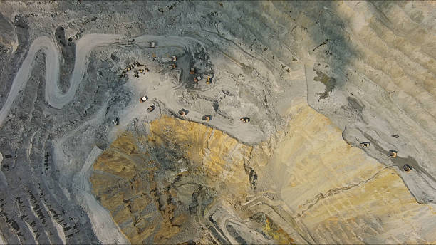 istock Aerial of open mine and heavy mining equipment 2237092149