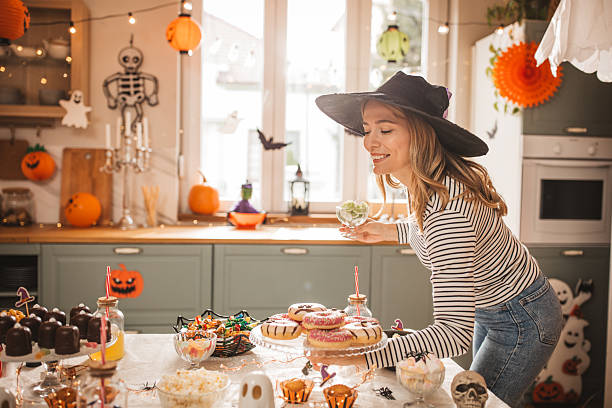 istock Woman preparing food table for Halloween 2237093111