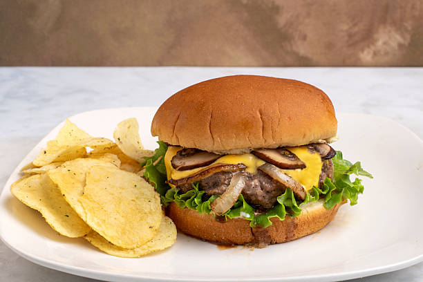 istock cheese burger top with onions and mushrooms 2237093688