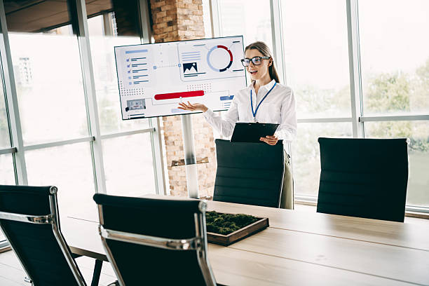 istock Charming young business professional presenting digital data insights in a contemporary office setting with natural lighting 2237094445