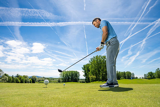 A middle-aged Japanese man enjoying golf