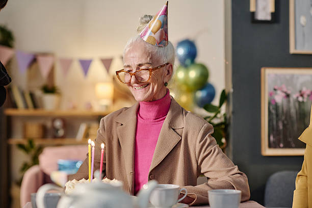 istock Senior Woman Smiling While Celebrating Birthday at Home Gathering 2237097322