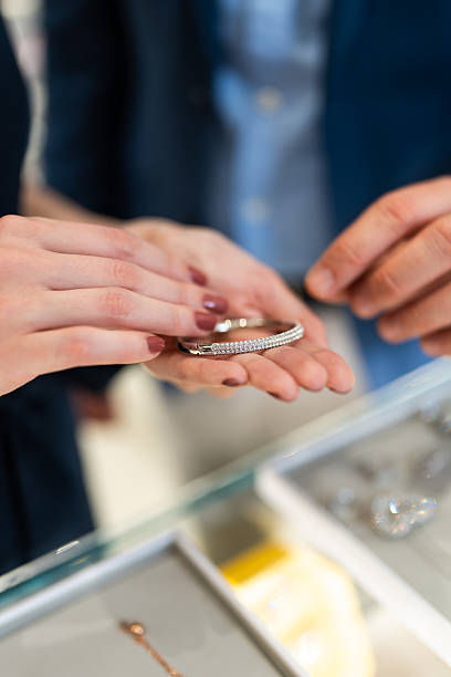 istock Couple choosing gold bracelet for elegant gift 2237097752
