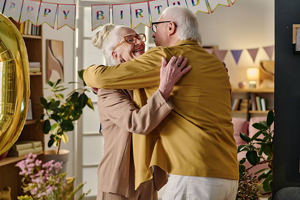 istock Senior Woman Hugging Senior Man during Birthday Celebration 2237098652
