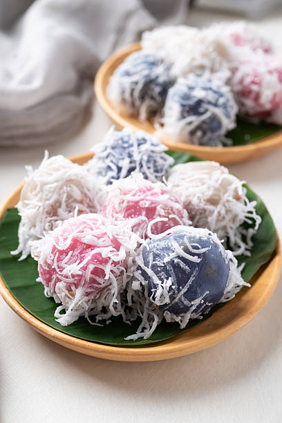 istock Thai coconut ball (Khanom Tom), Traditional Thai dessert made from boiled glutinous rice flour stuffed with sweet coconut 2237100849