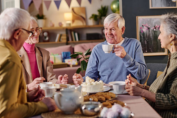 istock Group of Senior Friends Enjoying Conversation during Tea Gathering 2237102132