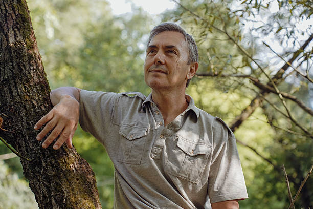 istock Senior Hiker Exploring Nature and Enjoying River Landscape 2237103756
