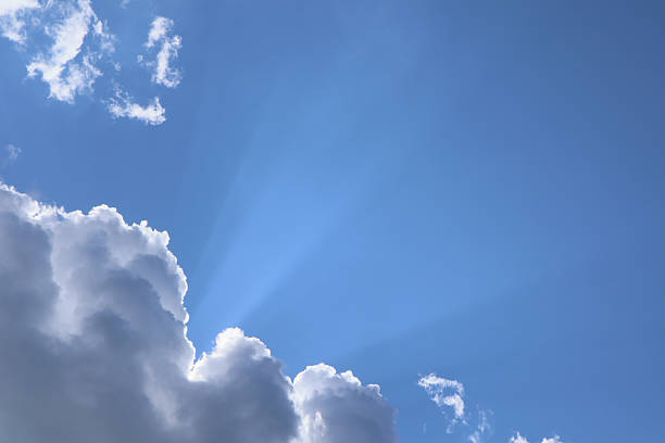 istock The sun's rays break through the clouds. A beautiful sky background. 2237103810
