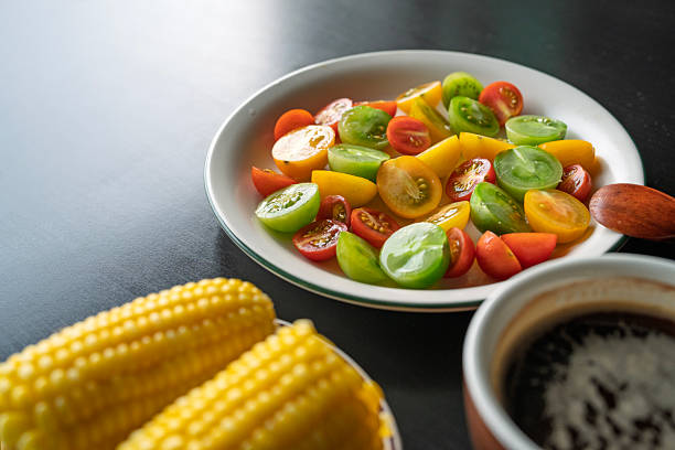 Heirloom tomato salad with corn on the cob and black coffee