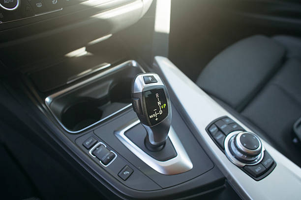 istock Interior view of a car featuring the gear shift and controls 2237109906