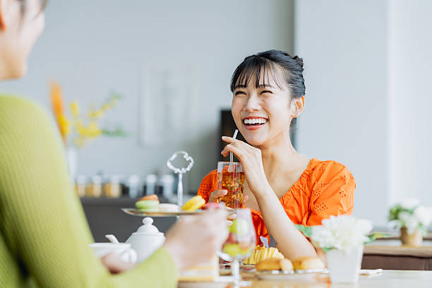 Young woman enjoying afternoon tea at a cafe