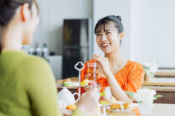 istock Young woman enjoying afternoon tea at a cafe 2237112161