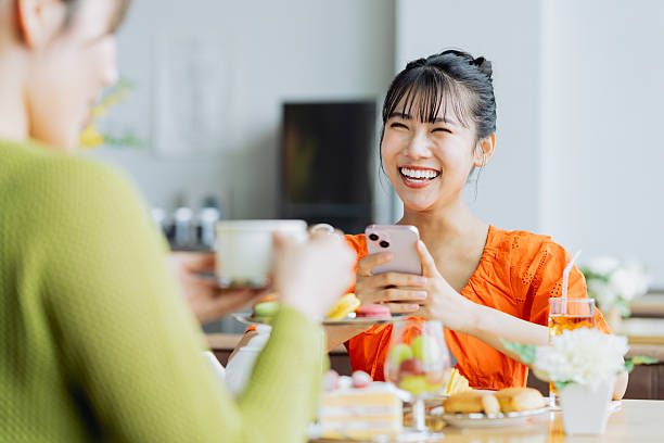 istock Young woman enjoying afternoon tea at a cafe 2237112169