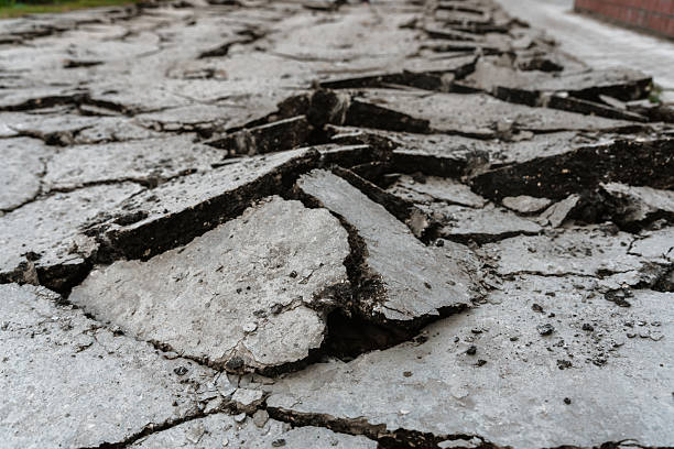 istock Raised destroyed asphalt, pieces of concrete 2237112309
