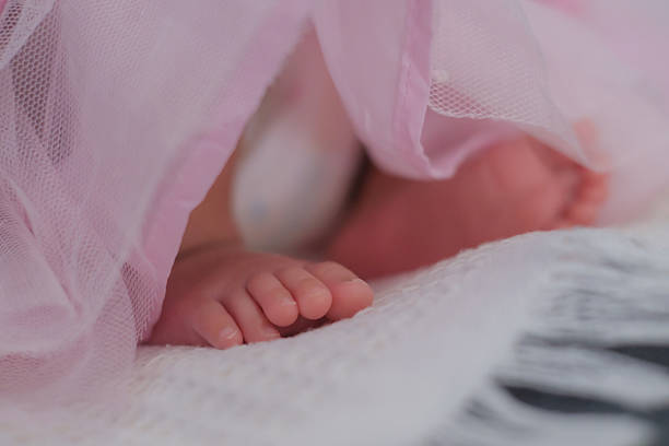 Newborn girl in the hospital on the day of her birth