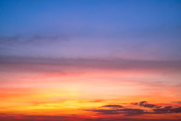 istock Sky,Beautiful sunset view, luxury soft gradient orange gold clouds and sunlight on the blue dramatic sky perfect for the background, morning, evening,Twilight, climate change,horizontal sunset photo 2237115465