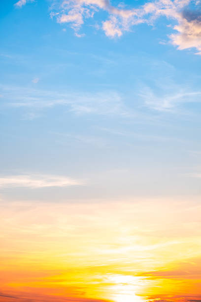 istock Beautiful , luxury soft gradient orange gold clouds and sunlight on the blue sky perfect for the background, take in evening,Twilight, Large size, high definition landscape photo,Vertical 2237115804