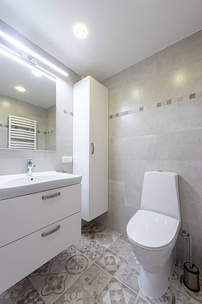 istock Modern Home Bathroom Interior With White Fixtures and Decorative Tile Floor 2237115815