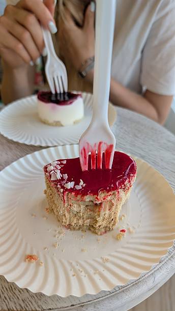 Delicious and delightful cake served with forks at a charming cafe setting for enjoyment