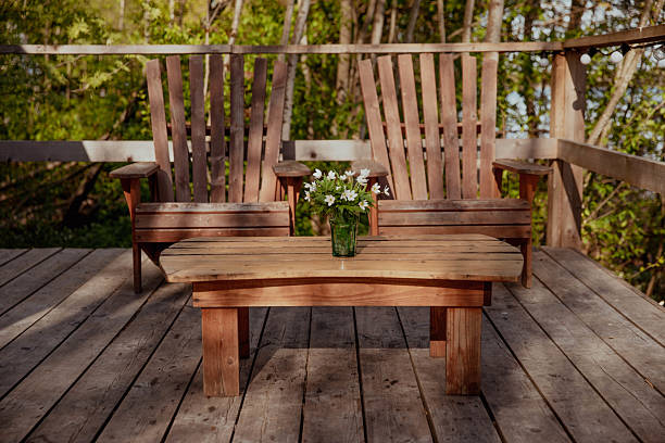 istock A wooden deck with cozy chairs and a sturdy table for relaxing 2237118806