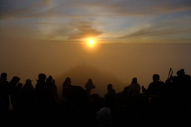 istock Silhouetted Sunrise Watchers 2237119393