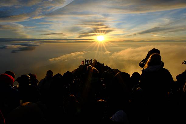 istock Hikers at Sunrise on Mountain Peak 2237119402