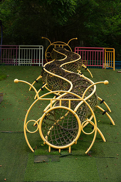 a whimsical caterpillar-shaped climbing tunnel