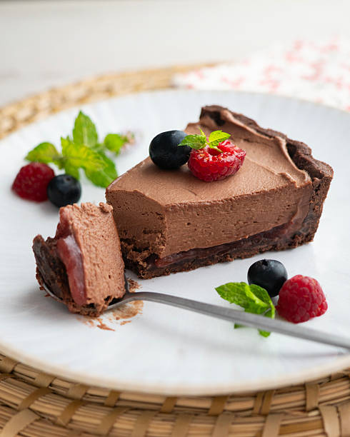 istock Chocolate mousse cake with red berries, blueberries, and raspberries. 2237124765