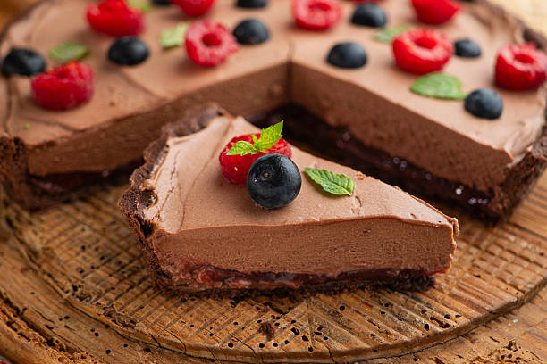 istock Chocolate mousse cake with red berries, blueberries, and raspberries. 2237124769