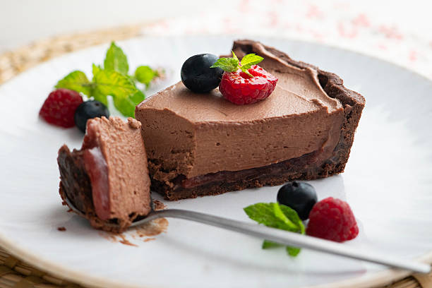 istock Chocolate mousse cake with red berries, blueberries, and raspberries. 2237124794