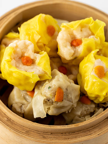 istock Delicious Dumplings in Bamboo Steamer Garnished with Carrots 2237126414