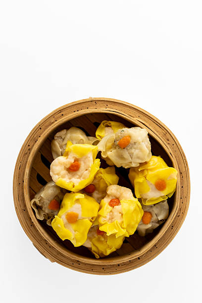 istock Fresh and Colorful Dumplings in a Bamboo Steamer Basket 2237126458
