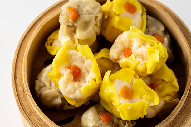 istock Colorful steamed dumplings in bamboo steamer close-up view 2237126477