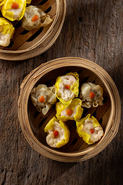 istock Freshly Steamed Dumplings in Bamboo Baskets Rustic Wooden Background 2237126694