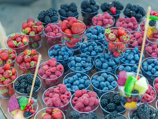 Colorful Assortment of Fresh Berries in Plastic Cups. High quality photo