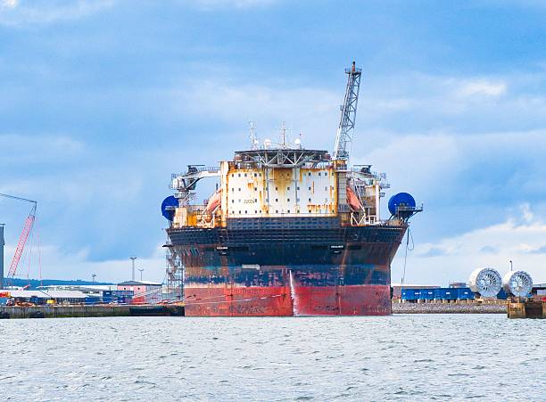 Nigg Bay, United Kingdom – July 01, 2025: An oil platform stationed next to a dock in Nigg Bay, Scotland