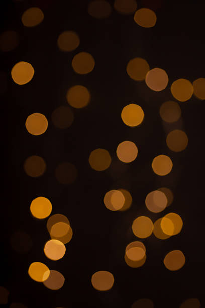 istock Christmas lights in bokeh. Yellow and fire orange bokeh 2237133398