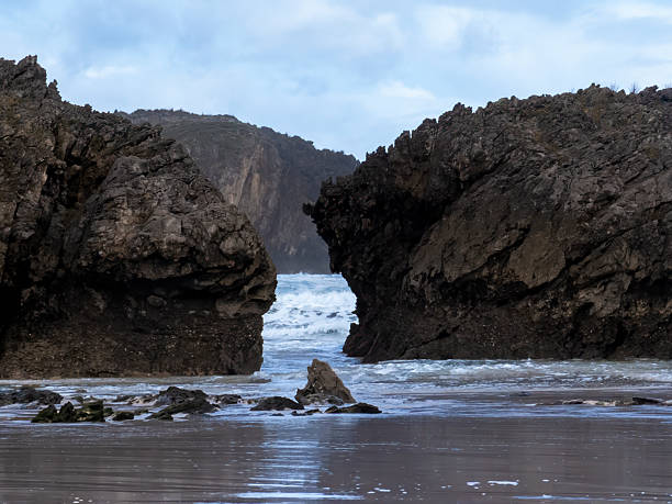 istock Sea waves breaking between rocks on coast in asturias 2237133923