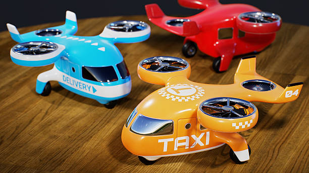 Group of stylized toy drones with two propellers, different themes and different colors on a wooden desk surface, 3D computer graphics