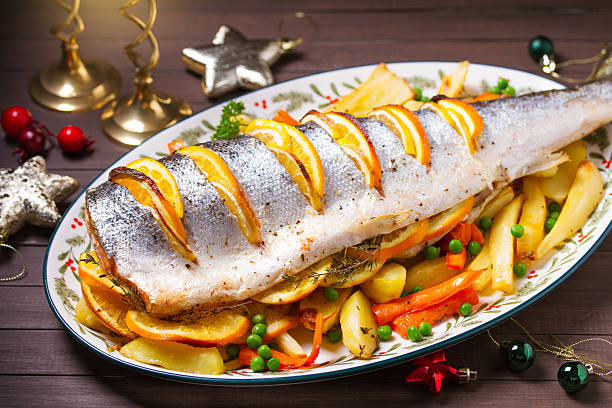 istock Roasted salmon with lemon, oranges and herbs served with vegetables 2237141123
