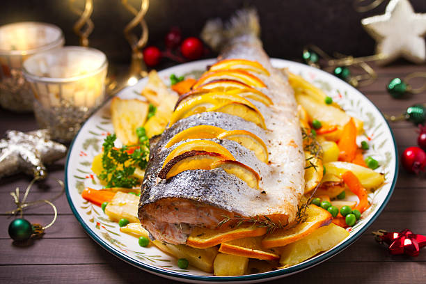 istock Roasted salmon with lemon, oranges and herbs served with vegetables 2237141142