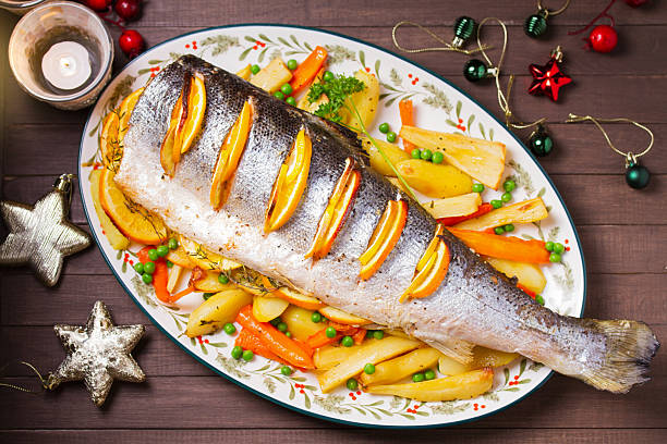 istock Roasted salmon with lemon, oranges and herbs served with vegetables 2237141144