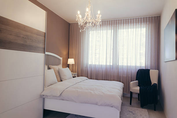 istock Cozy Bedroom Interior with Elegant Decor and Abundant Natural Light 2237141470