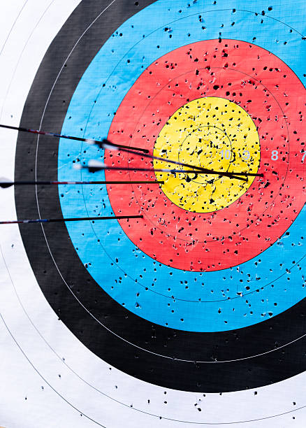 istock Arrows hitting a colorful archery target, representing aiming for goals, precision, and the concept of reaching targets 2237141660