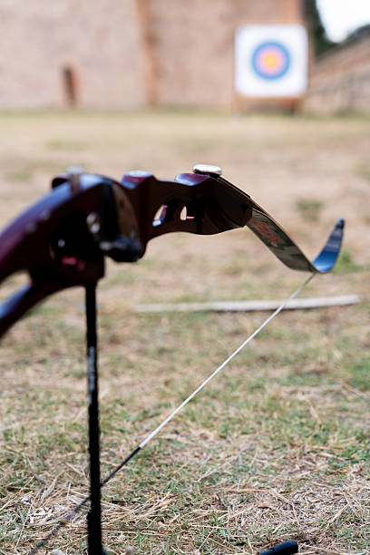 istock Archery bow resting on a stand with a blurred target in the background, symbolizing precision and focus in sport 2237141763
