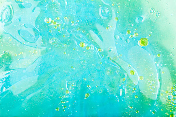 istock Abstract oil droplets on vibrant turquoise background creating soothing visual experience 2237143970