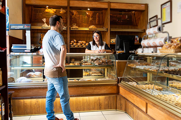 istock Customer talking to a salesperson in a local bakery 2237145043