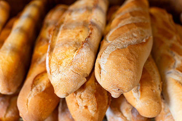 istock Freshly baked baguettes displaying golden crusts in a bakery 2237145102