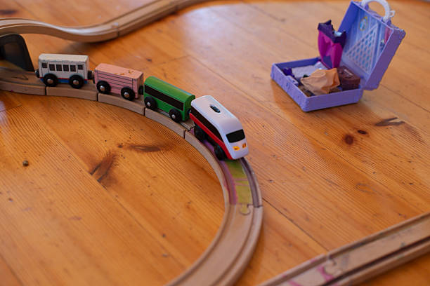 istock A toy train set on a wooden floor with accessories for imaginative play 2237150784